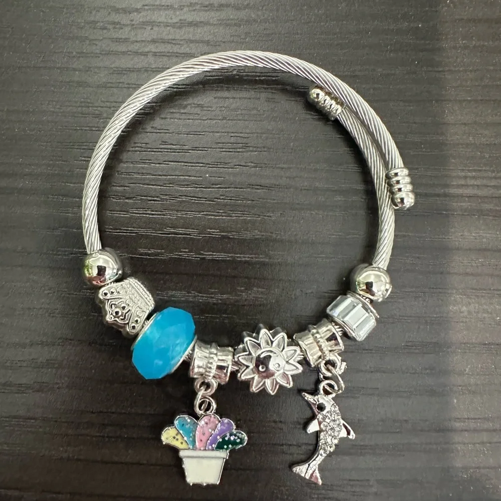Stainless Steel Cable Charm Bracelet – Blue Bead Dolphin & Celestial Charms